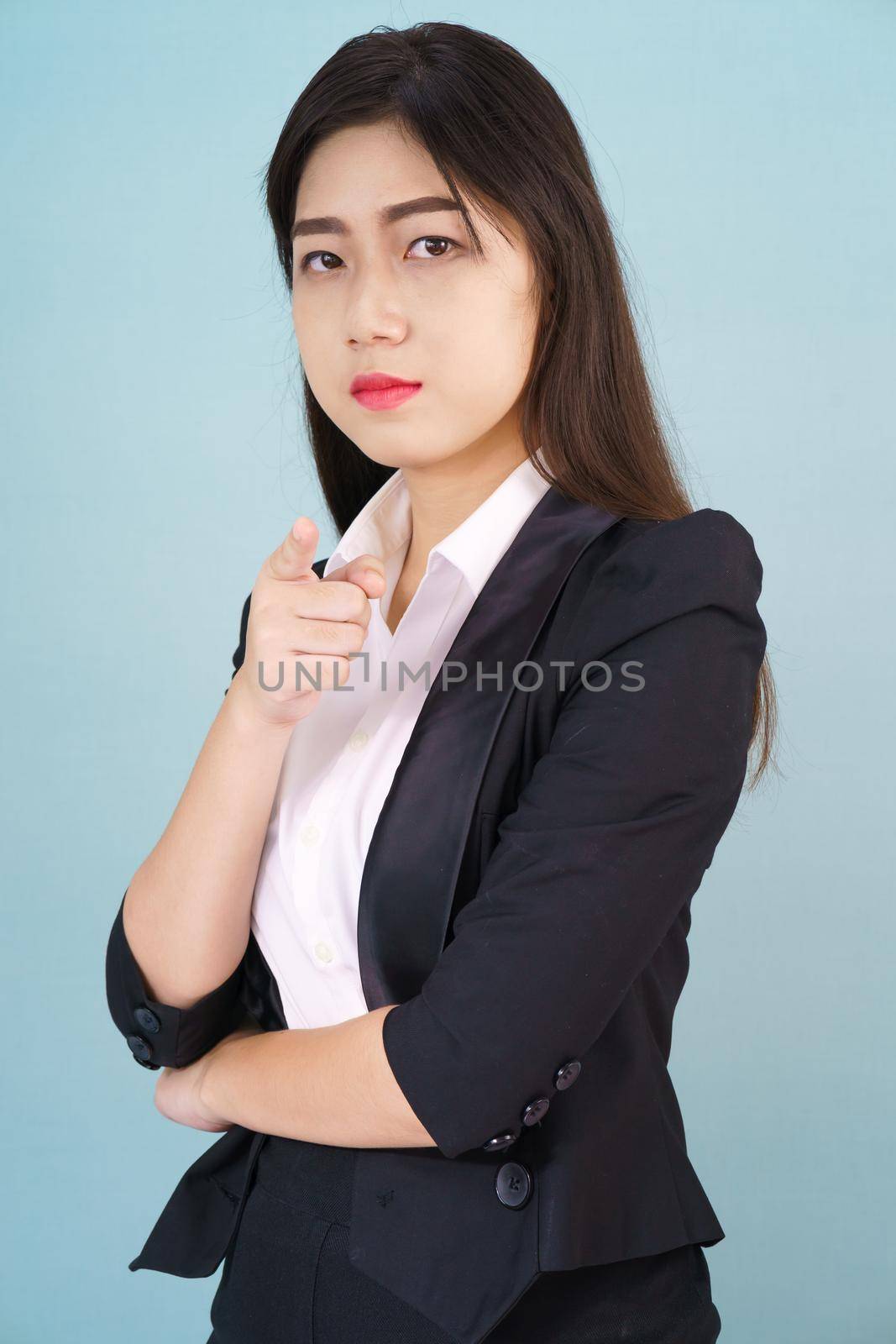 Woman looking at camera and pointing finger by stoonn