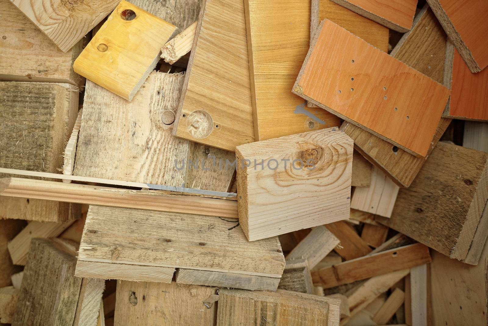 Short wooden cuts of boards and lumber. Woodworking waste in the carpentry shop. Top view by SergeyPakulin