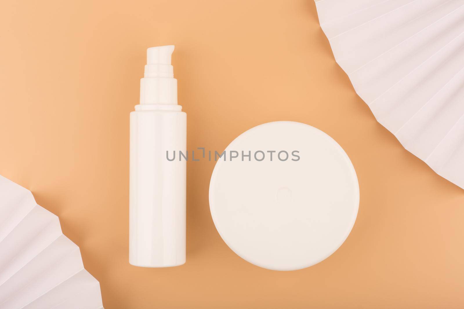 Flat lay with face and body cream on beige decorated background by Senorina_Irina