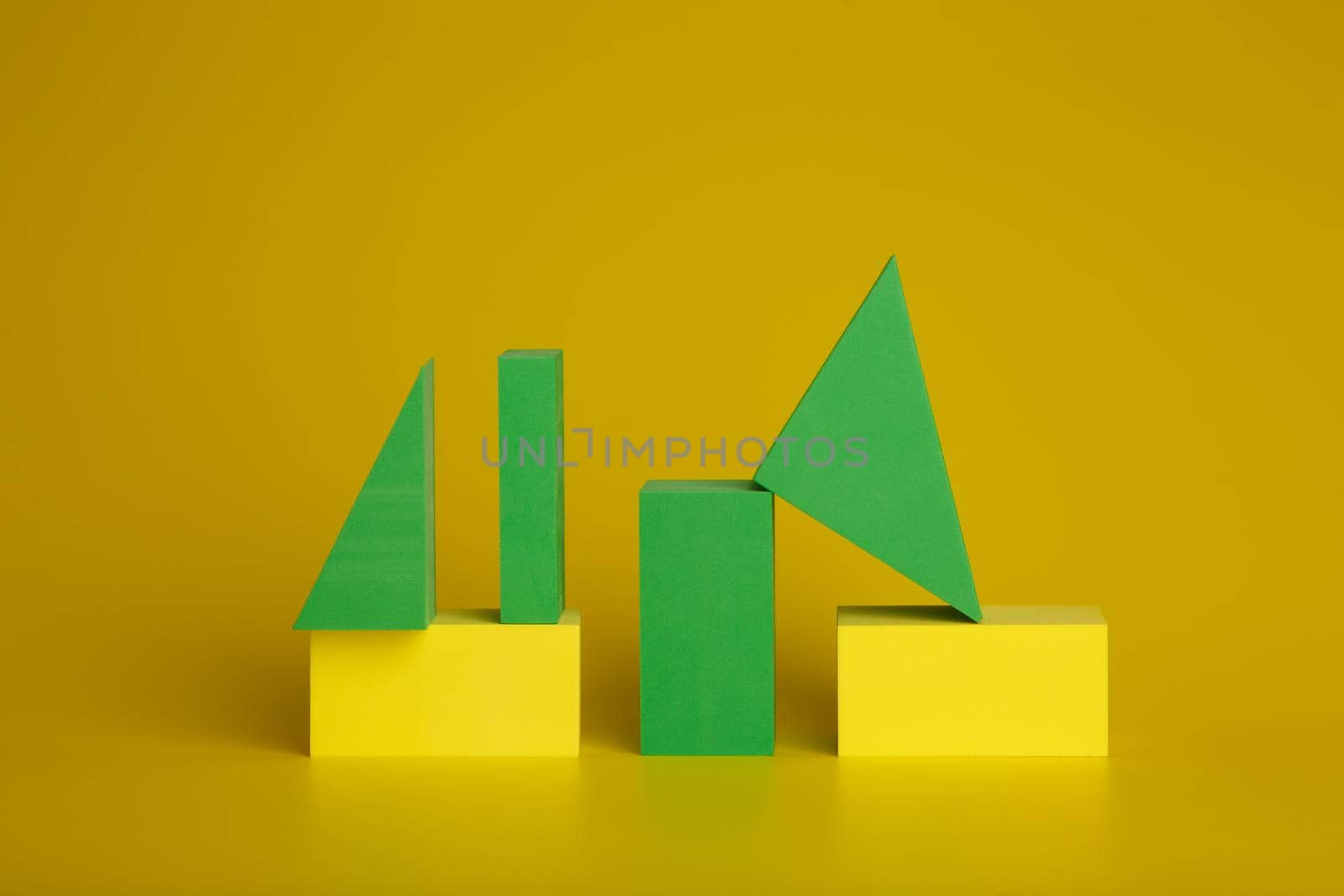 Abstract duotone background with green and yellow geometric figures on yellow background by Senorina_Irina