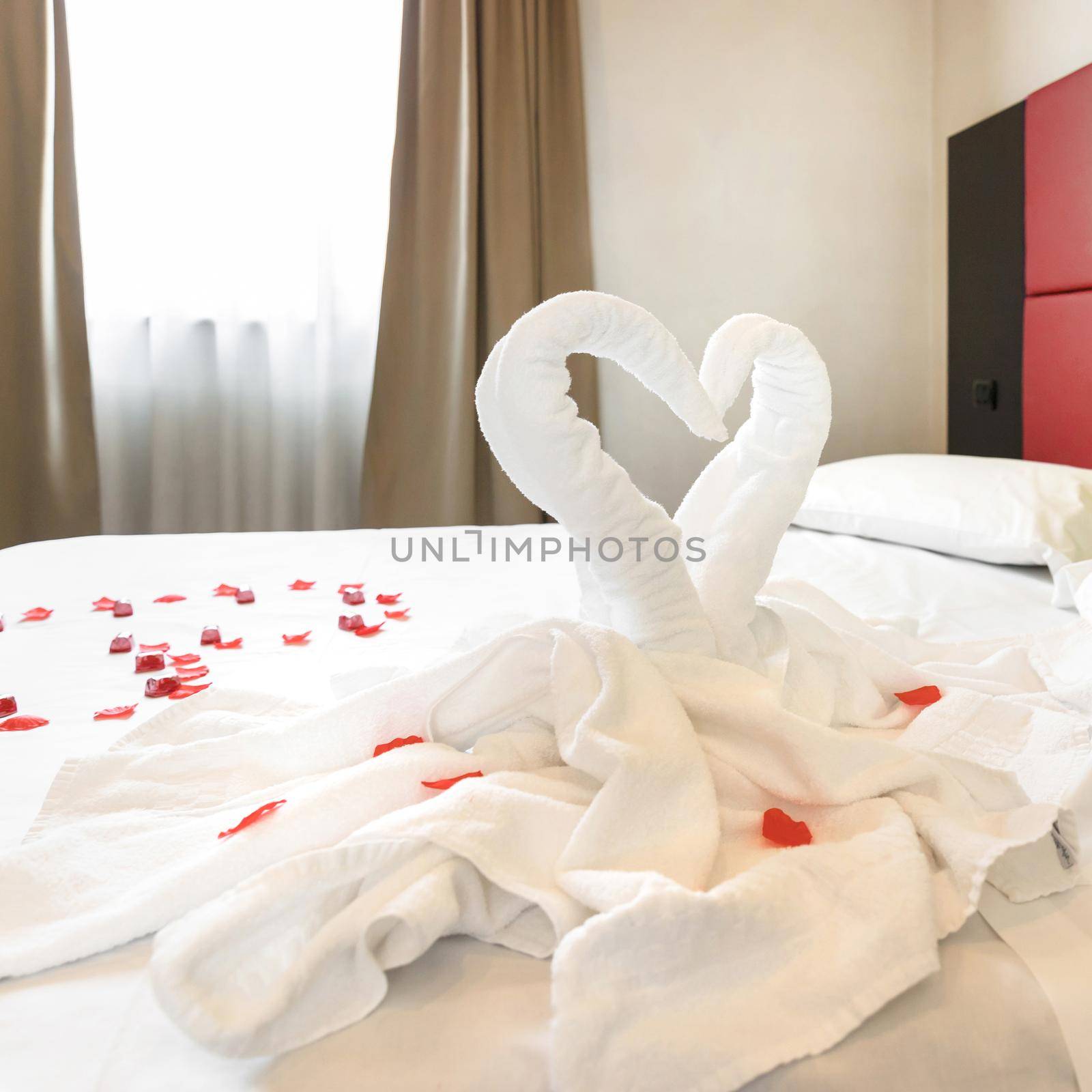 Figures of swans made of white towels in a hotel by germanopoli