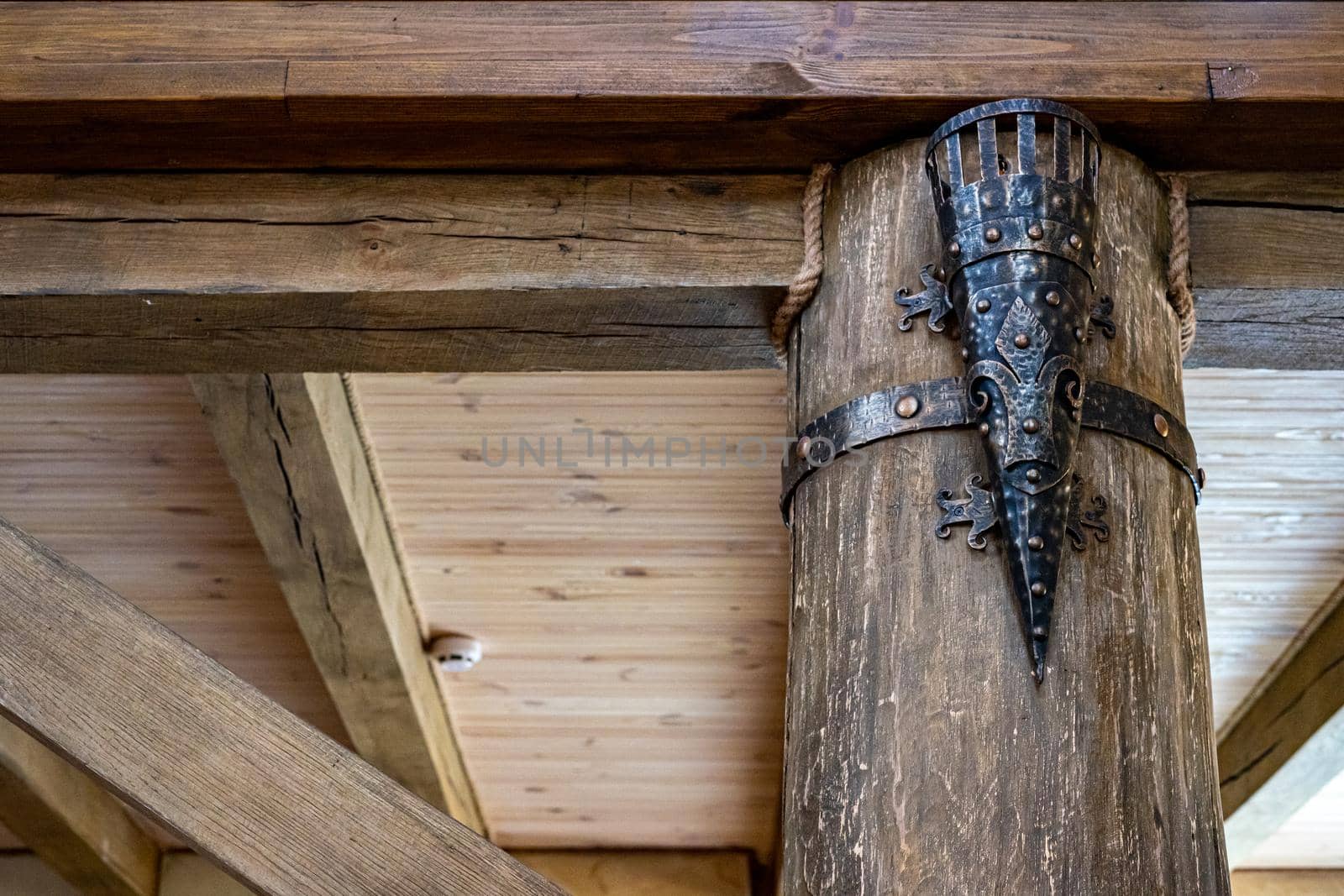 Ancient torch. Wooden interior. Elements of decor in the old style. by Serhii_Voroshchuk