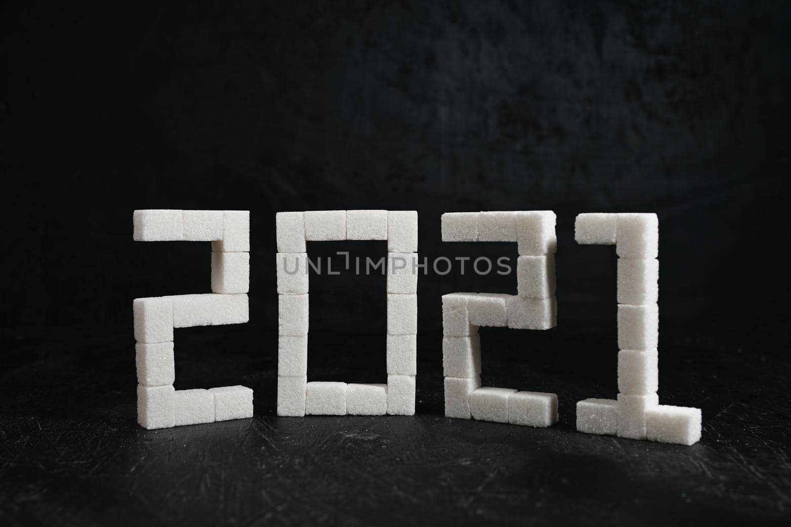 New Year 2021. Figures from sugar cubes. Decoration.