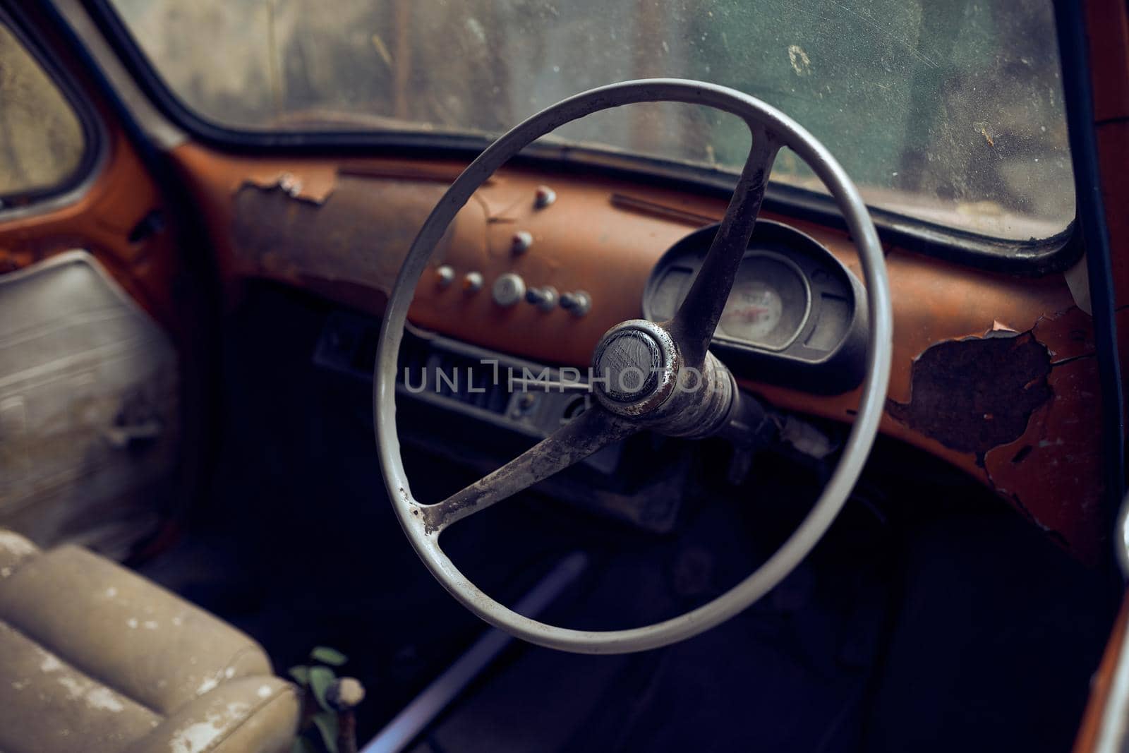 Interior of an old vintage car wreck in an old street