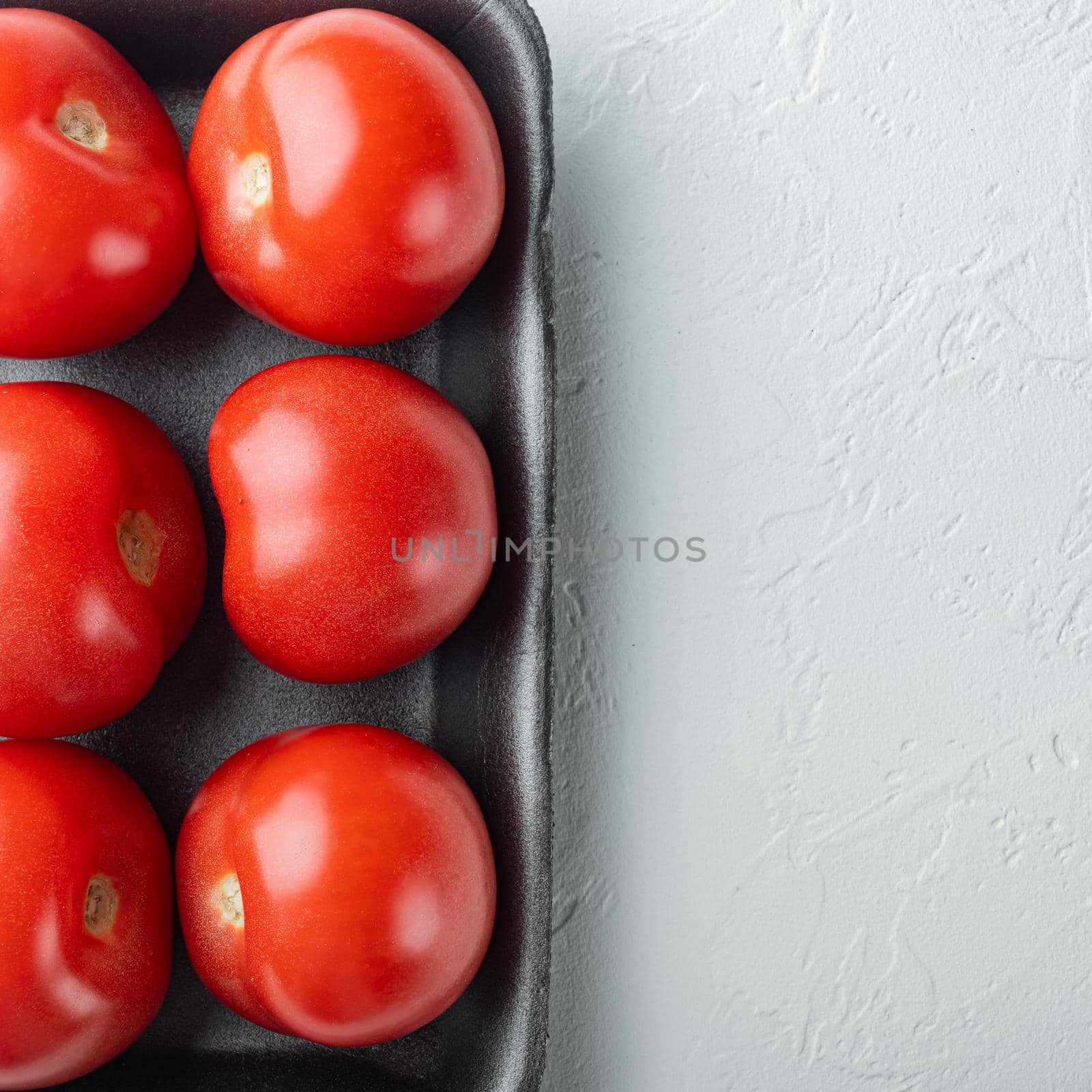 Fresh red organic tomatoe, on white background with copy space for text by Ilianesolenyi