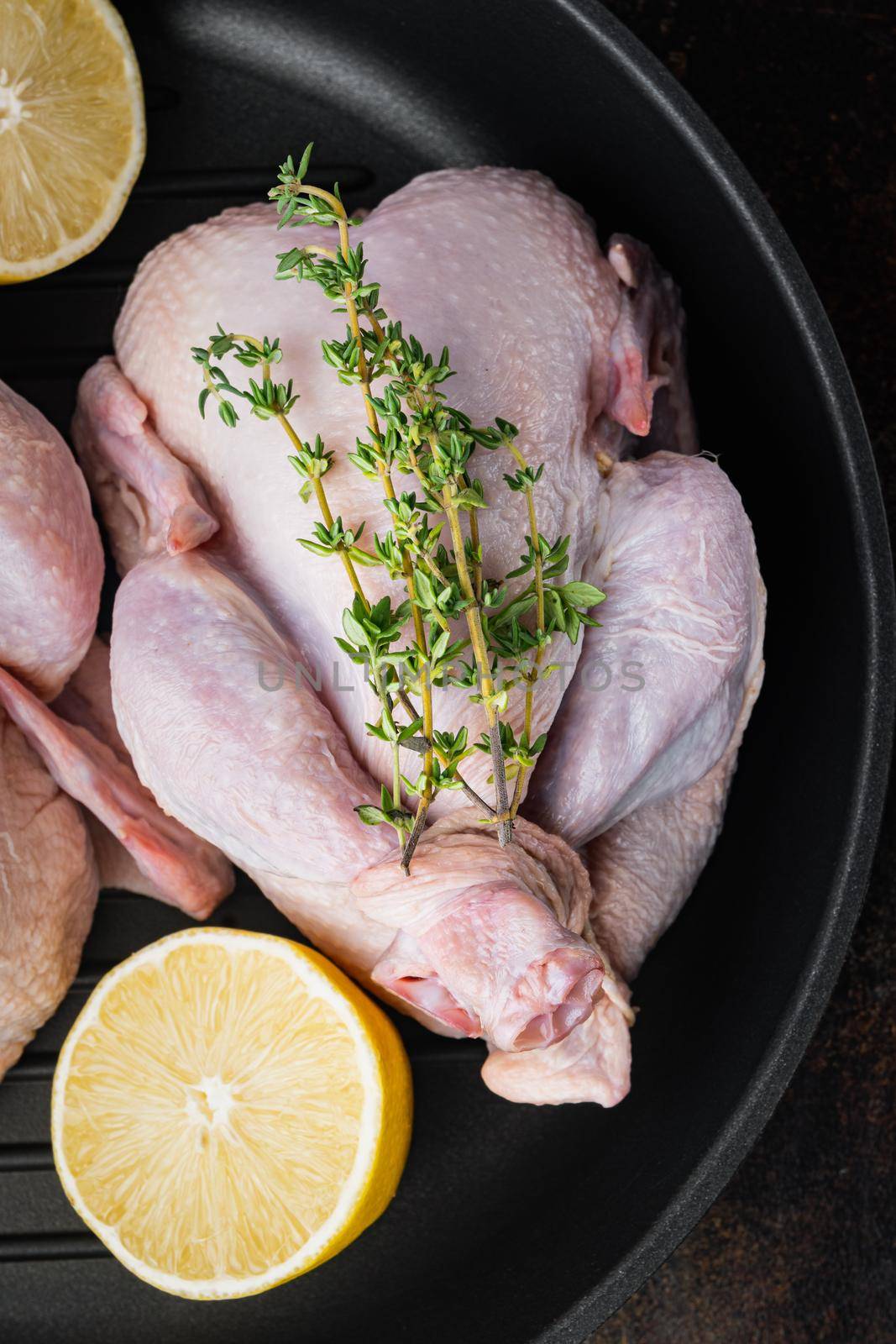 Fresh raw chicken meat on grill pan, on old rustic background, top view
