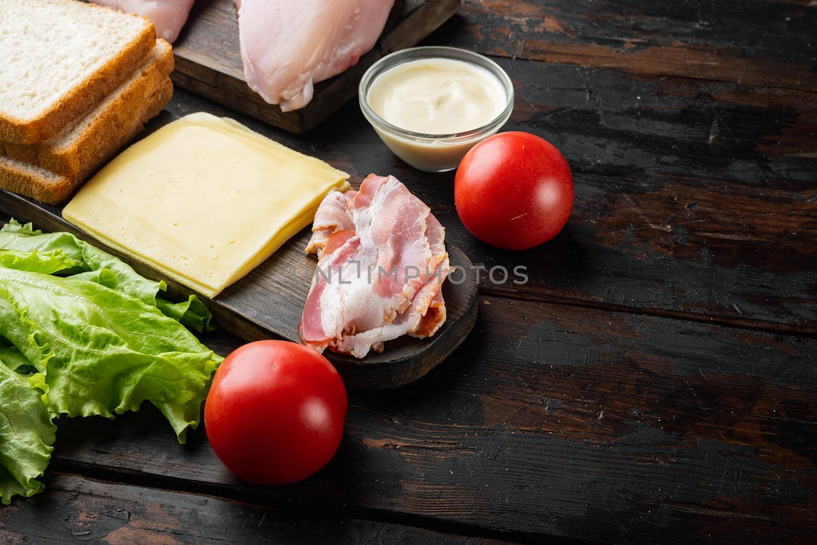 Club sandwich ingredient, on old wooden table with copy space for text
