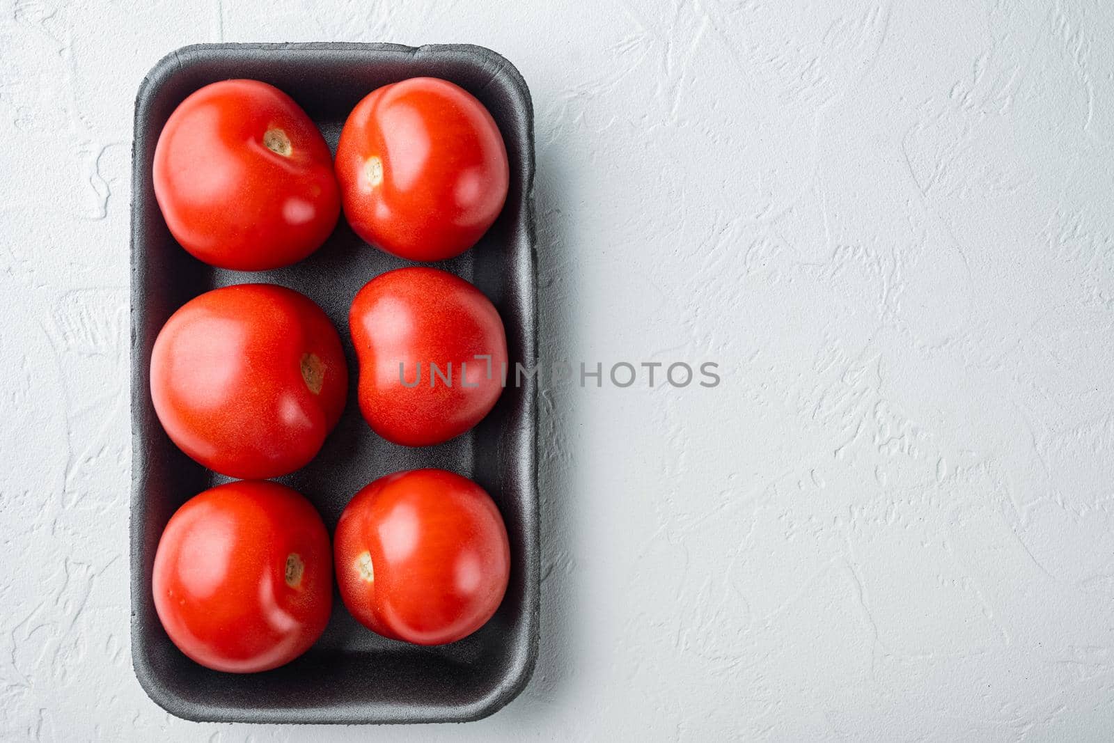 Red tomatoes, on white background with copy space for text