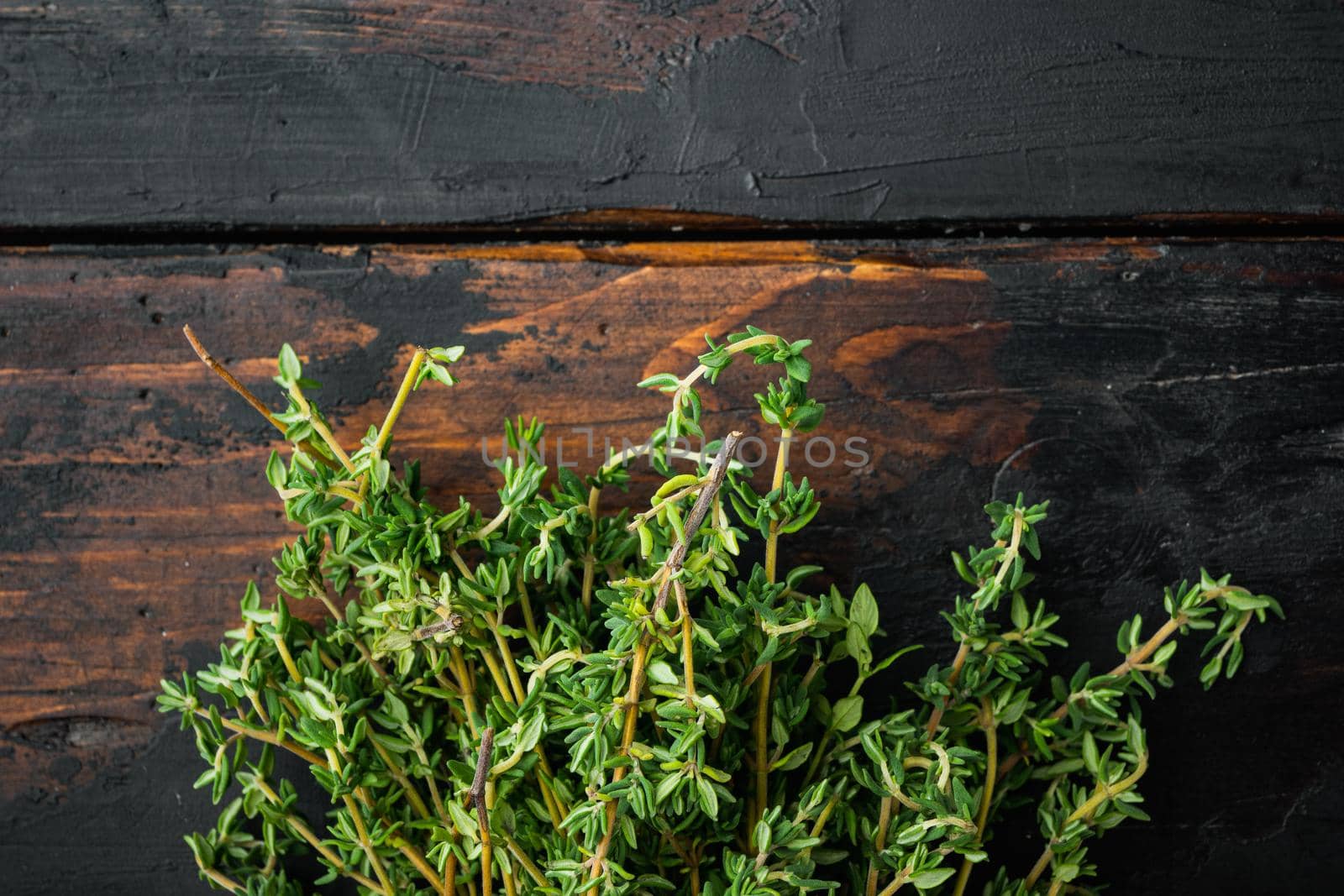Thyme green fresh bunch, on old wooden table, top view