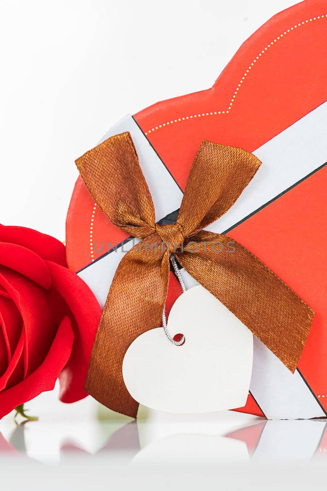 Close up red roses and heart-shaped box ,Valentine's Day concept with roses and red heart-shaped box
