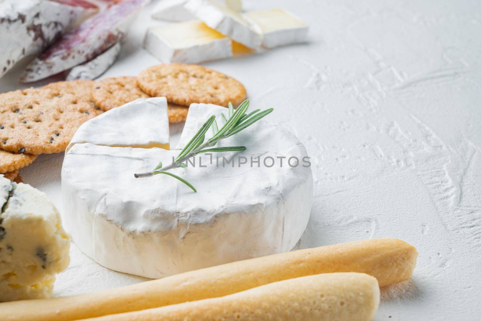 French soft camembert of normandy cheese set, on white background with copy space for text