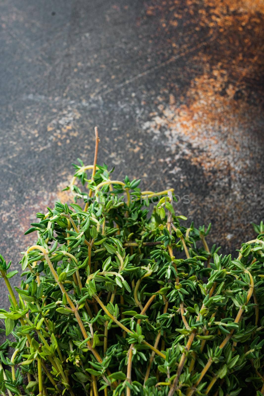 Thyme green bunch, on old rustic background, top view with copy space for text