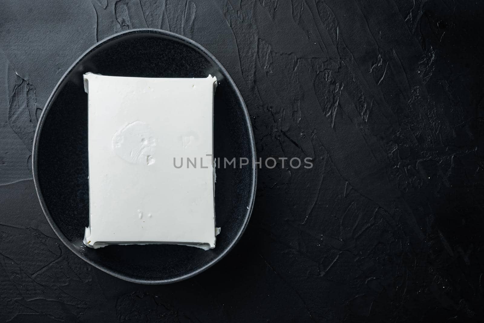 Fresh greek feta cheese set, on black background, flat lay with copy space for text