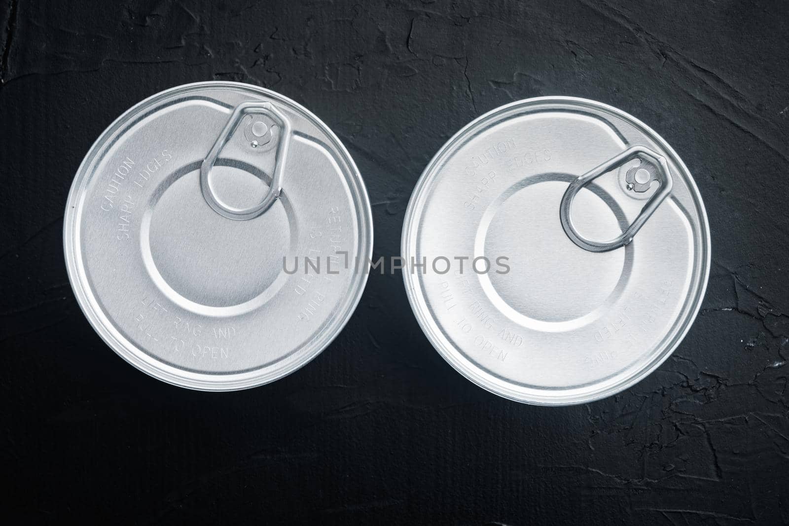 Canned sauce tin can, on black background, top view or flat lay