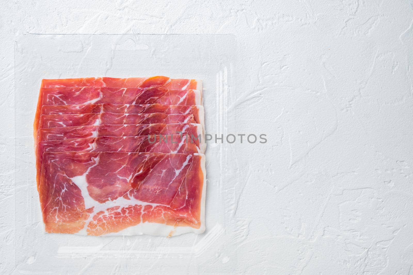Italian antipasto hamon set, on white background, top view with copy space for text