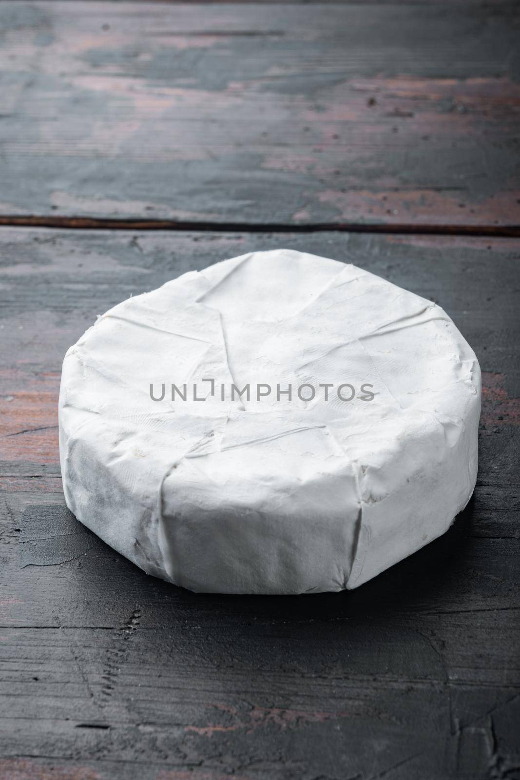 Camembert or brie cheese set, on old wooden table