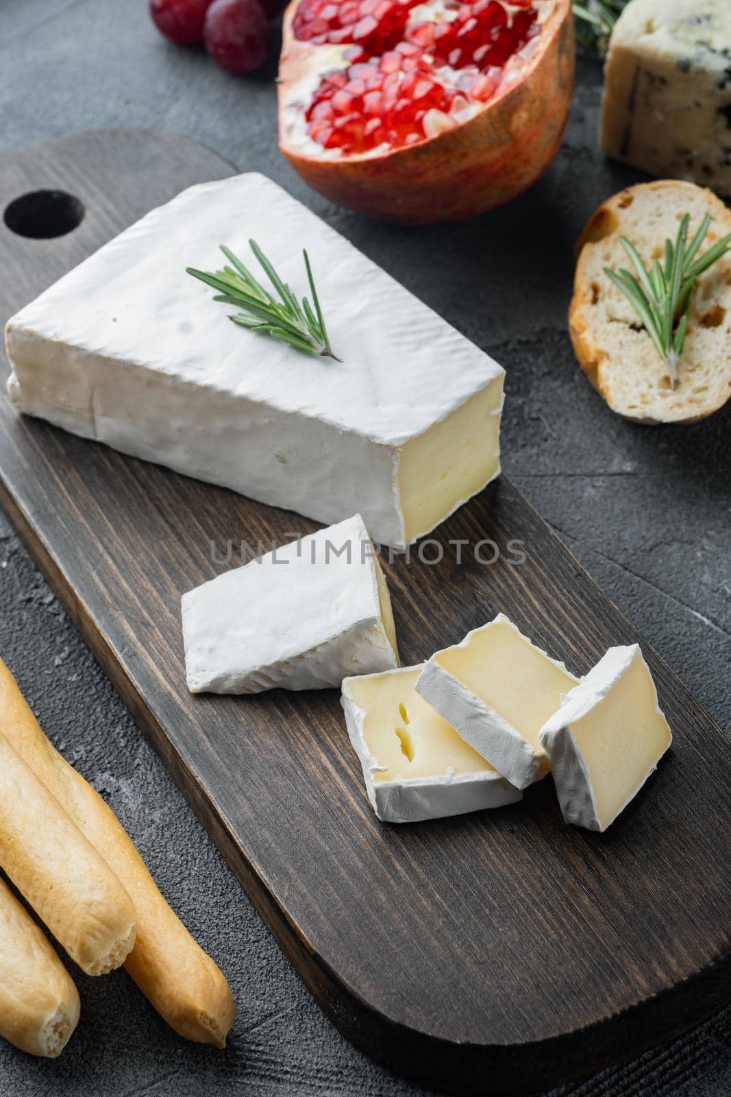 Slice of brie farmhouse creamy soft cheese set, on gray background