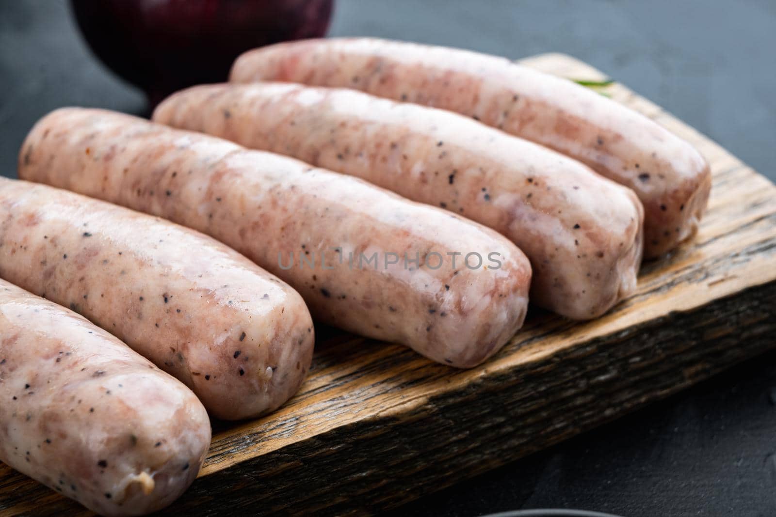 Traditional mest sausages, on black background.
