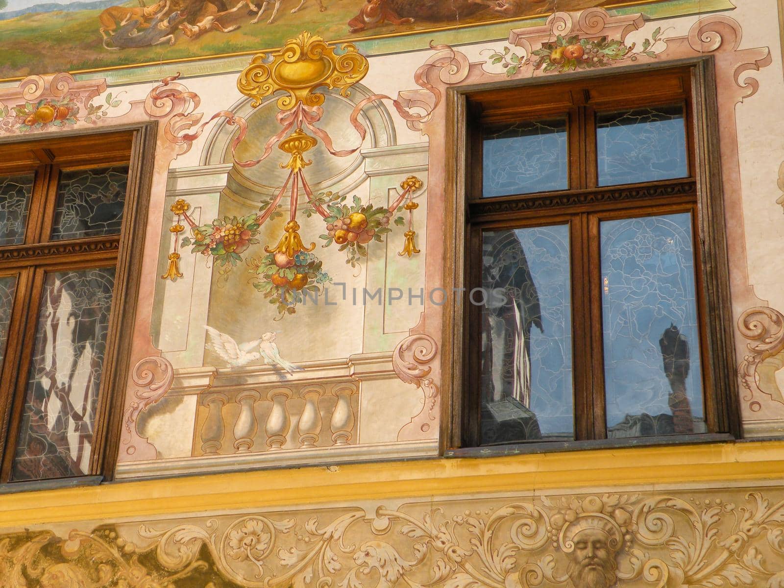 Classical painted wall of building with opened windows by mtx
