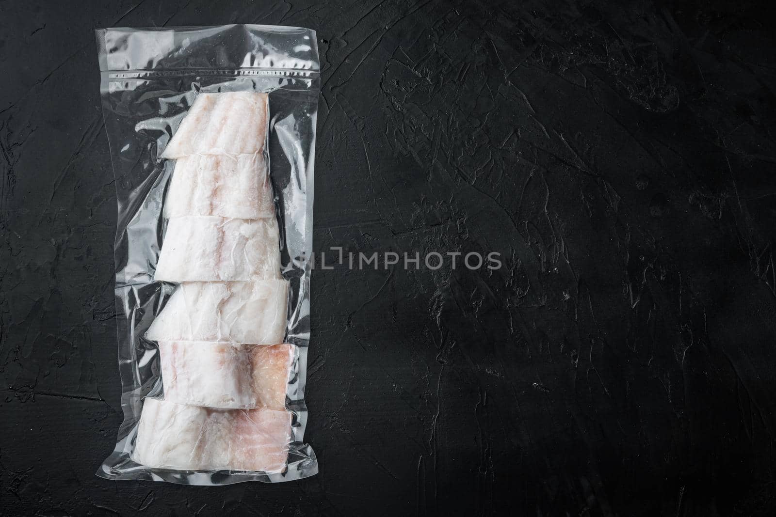 Haddock fish skinless in vacuum package, top view with copy space for text