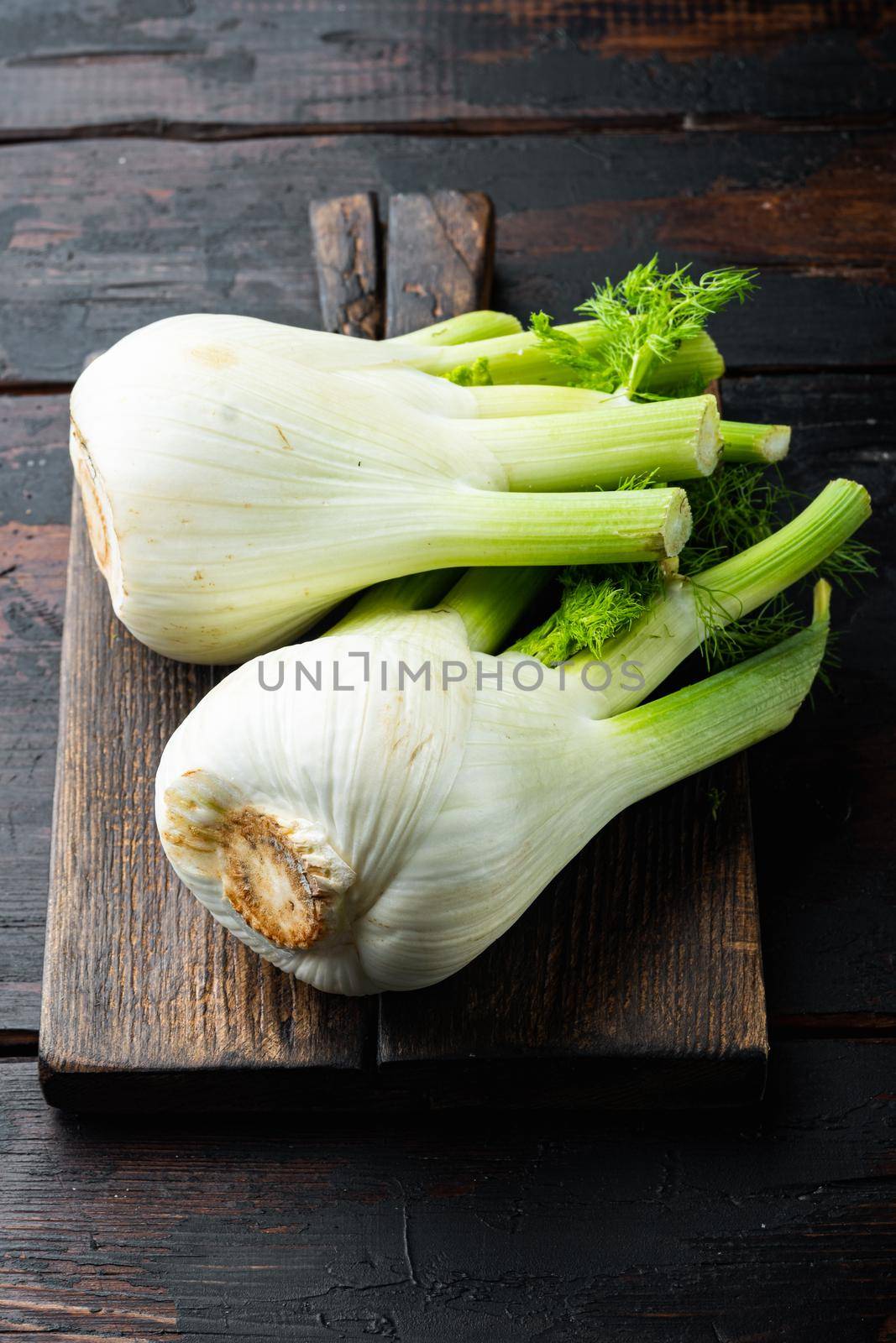 Genuine fresh raw fennel, on old wooden table