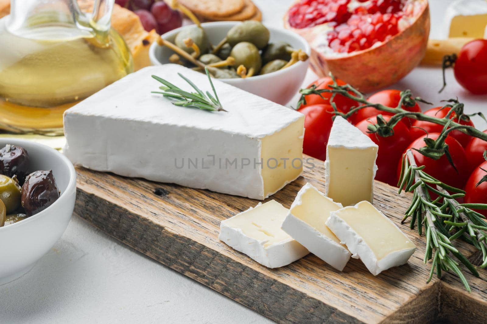 Brie type of cheese set, on white background