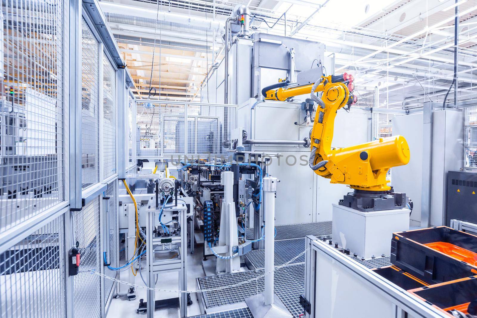 robotic arms in a car plant