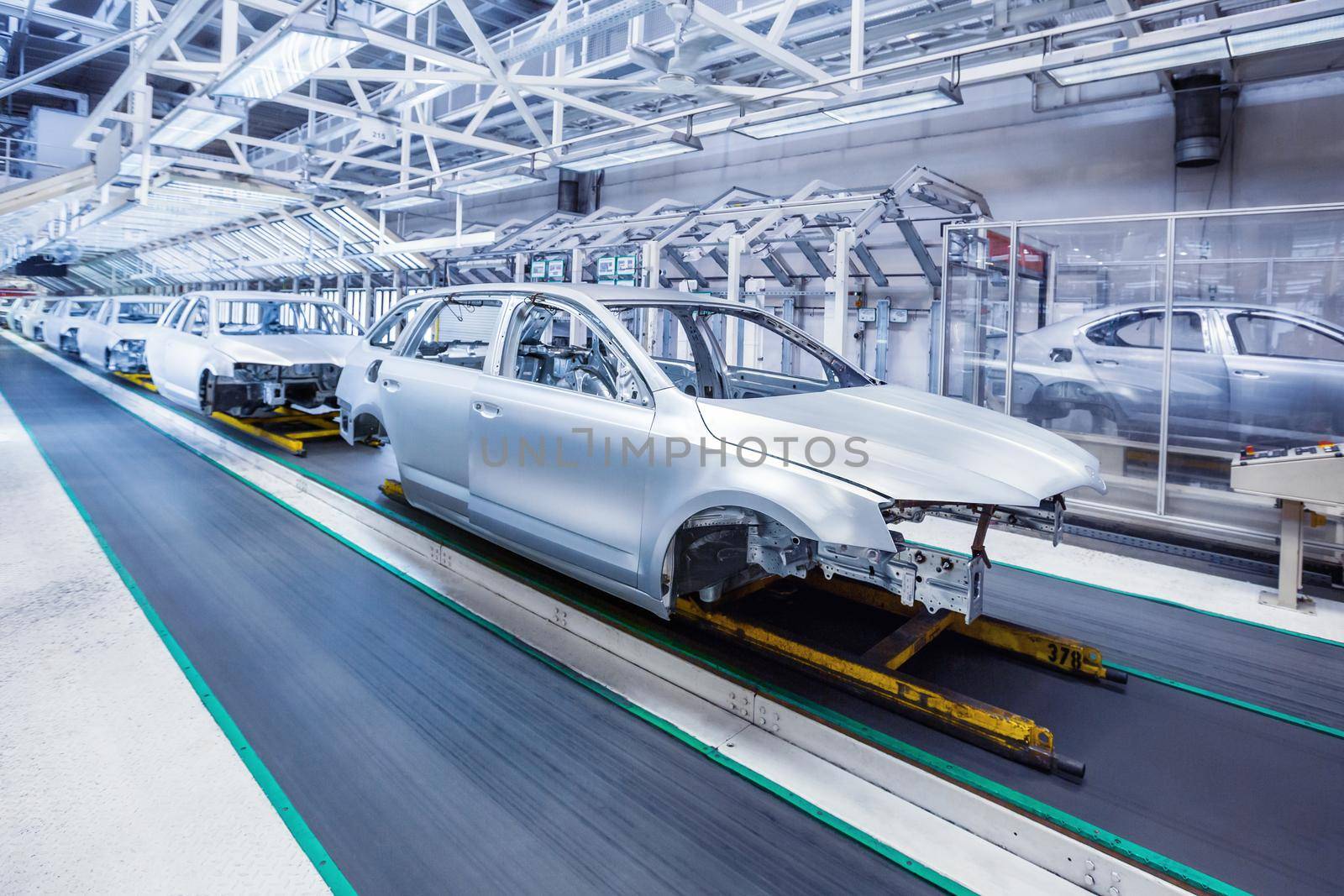 prepared chassis in a row at car plant