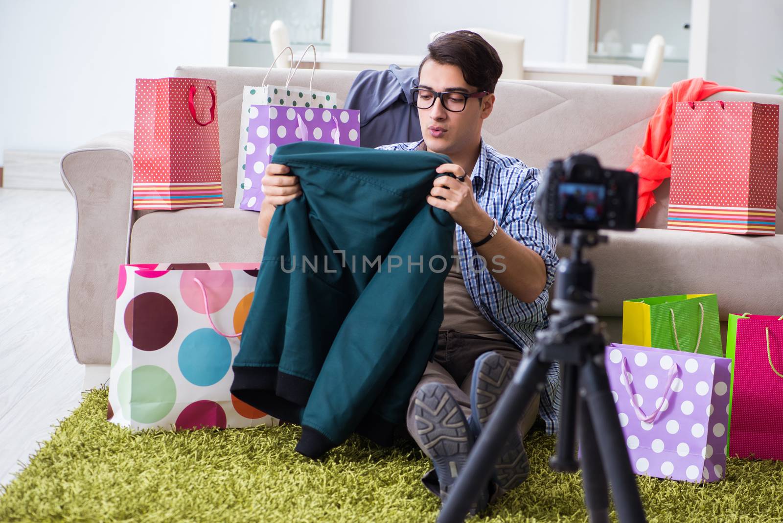Male fashion blogger recording video for vlog by Elnur