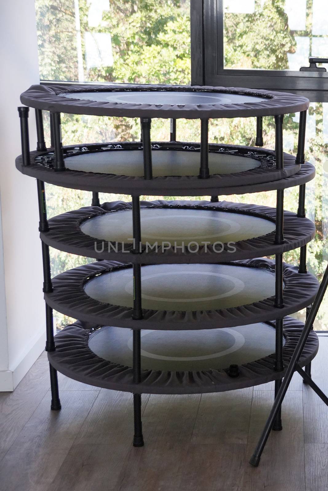 folded fitness trampolines in the gym