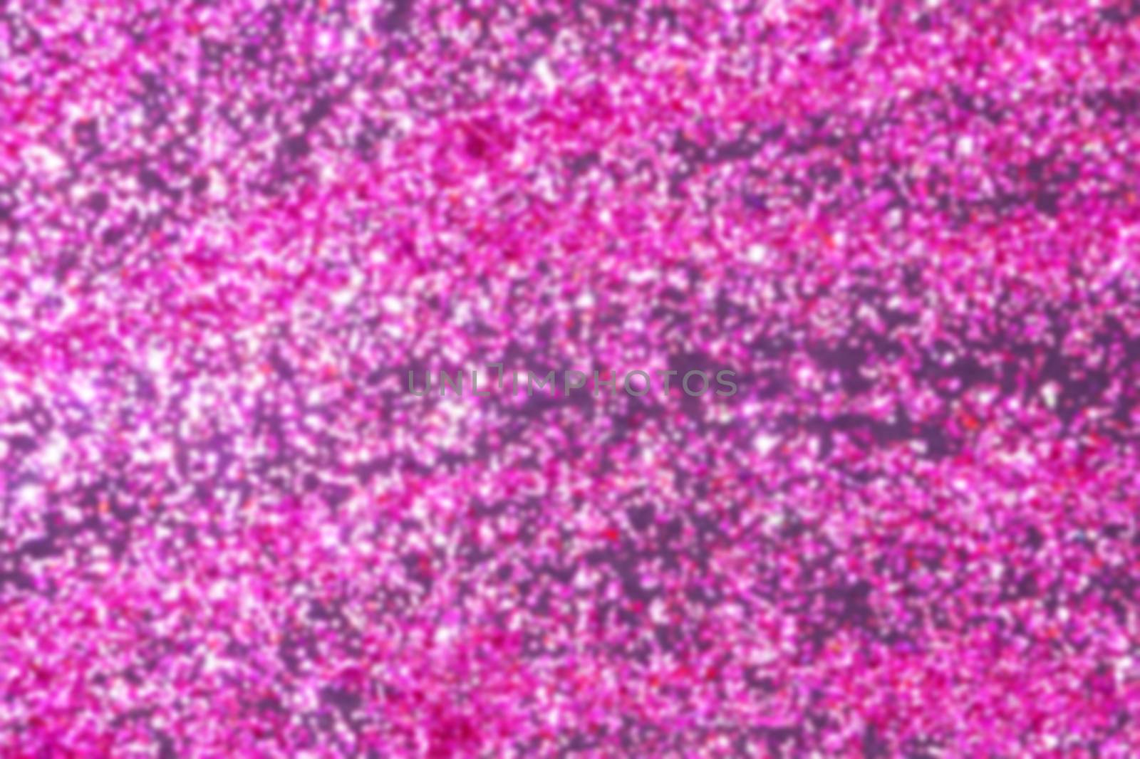 dark pink shiny glitter on black background.