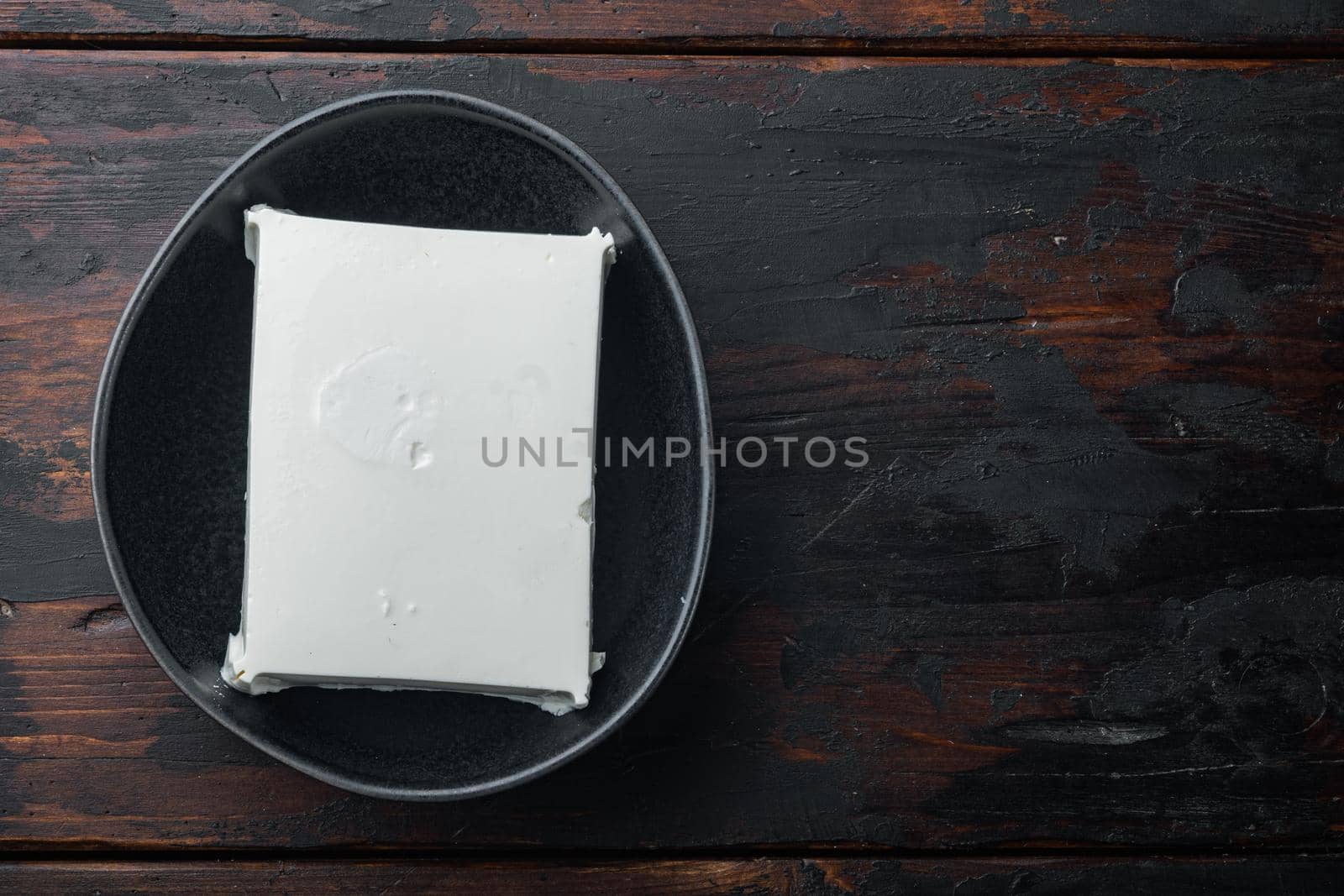 Fresh greek feta cheese set, on old wooden table, flat lay with copy space for text