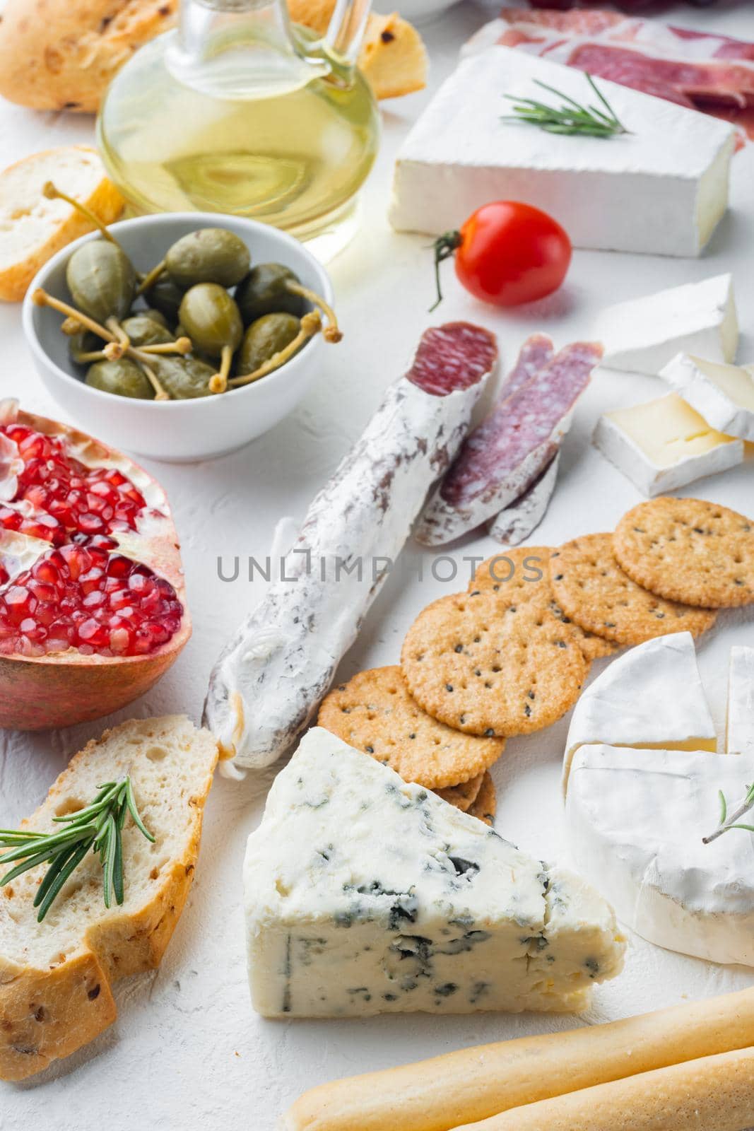 Italian snacks, meat cheese, herbs set, on white background