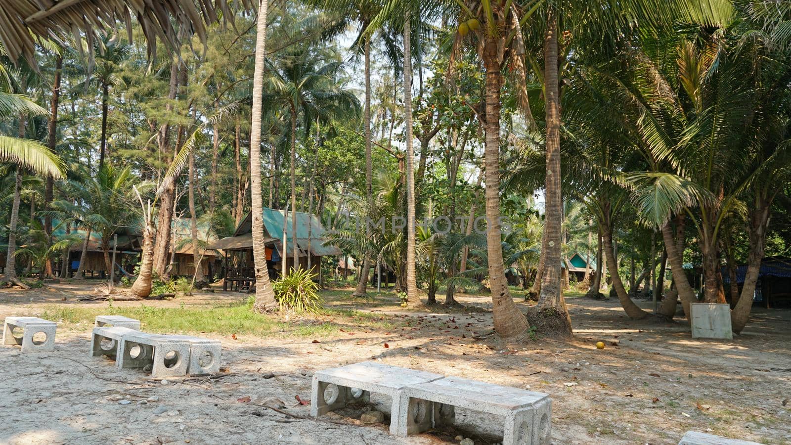 Old houses on an island in jungle. Chang Island. by Passcal