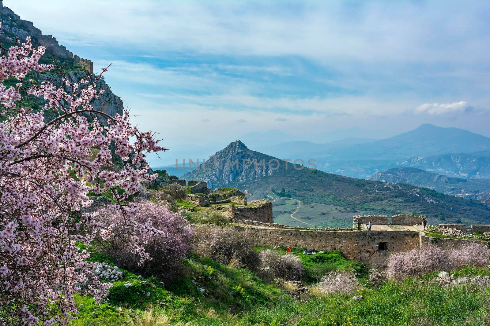 Visitors at Medieval fortress Acrocorinth on a sunny day, Peloponnese, Greece by ankarb