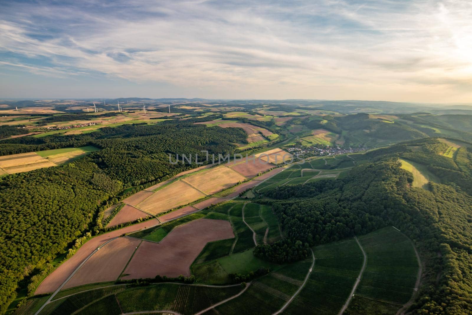 Aerial view at a landscape in Germany, Rhineland Palatinate near Bad Sobernheim with the river Nahe, meadow, farmland, forest, hills, mountains 