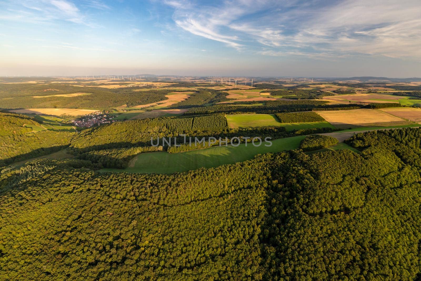 Aerial view at a landscape in Germany, Rhineland Palatinate near Bad Sobernheim with  meadow, farmland, forest, hills, mountains 