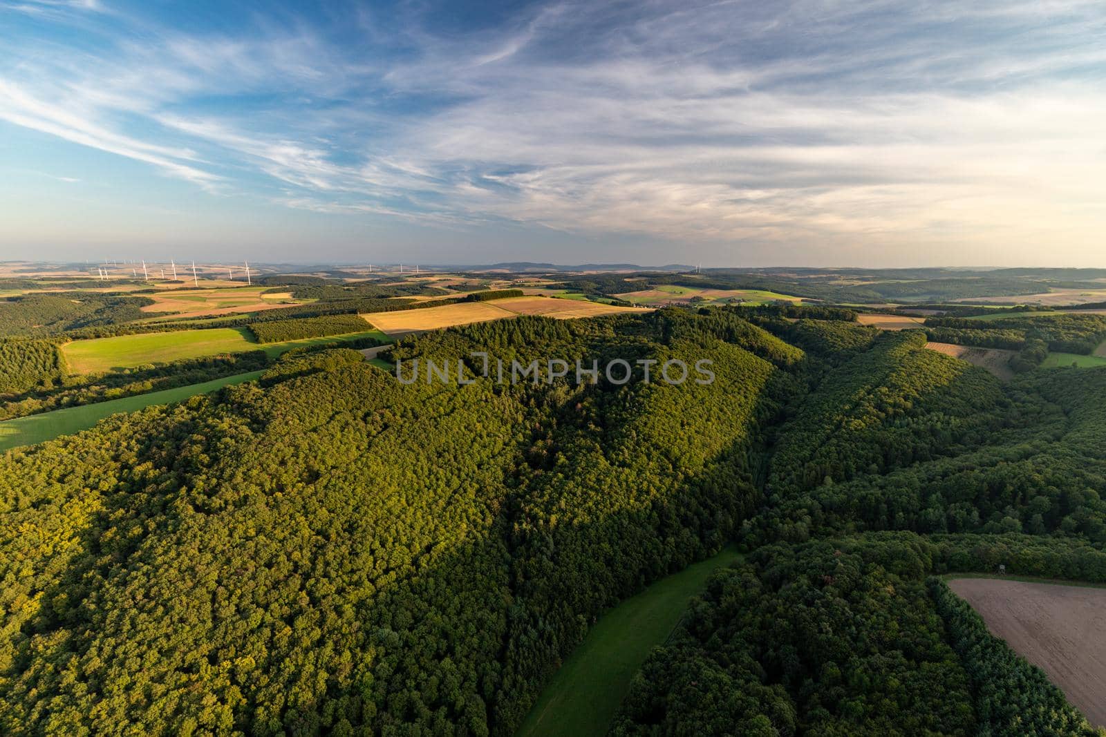 Aerial view at a landscape in Germany, Rhineland Palatinate near Bad Sobernheim with meadow, farmland, forest, hills, mountains 