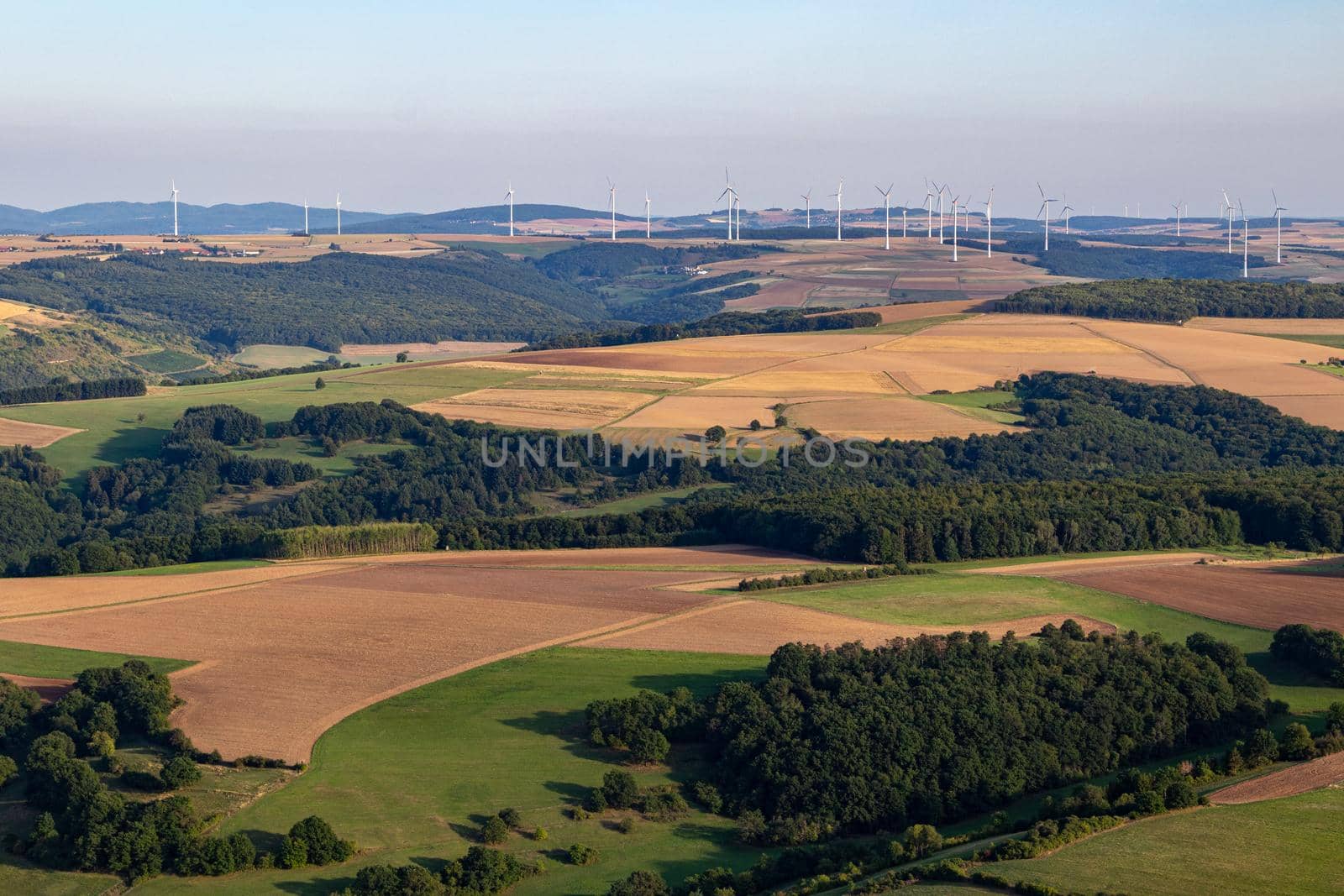 Aerial view at a landscape in Germany, Rhineland Palatinate near Bad Sobernheim with meadow, farmland, forest, hills, mountains 