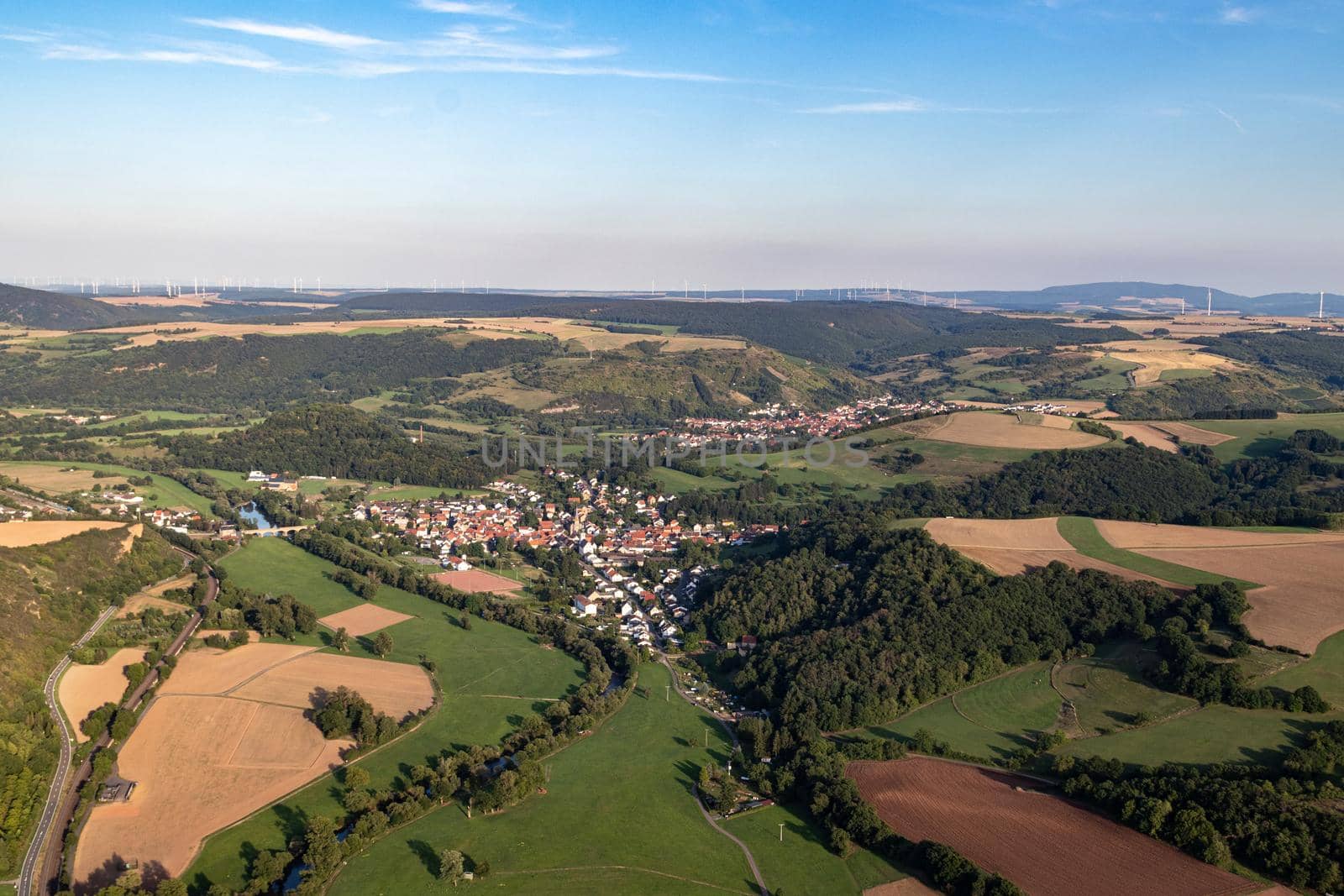 Aerial view at a landscape in Germany, Rhineland Palatinate near Bad Sobernheim with meadow, farmland, forest, hills, mountains 