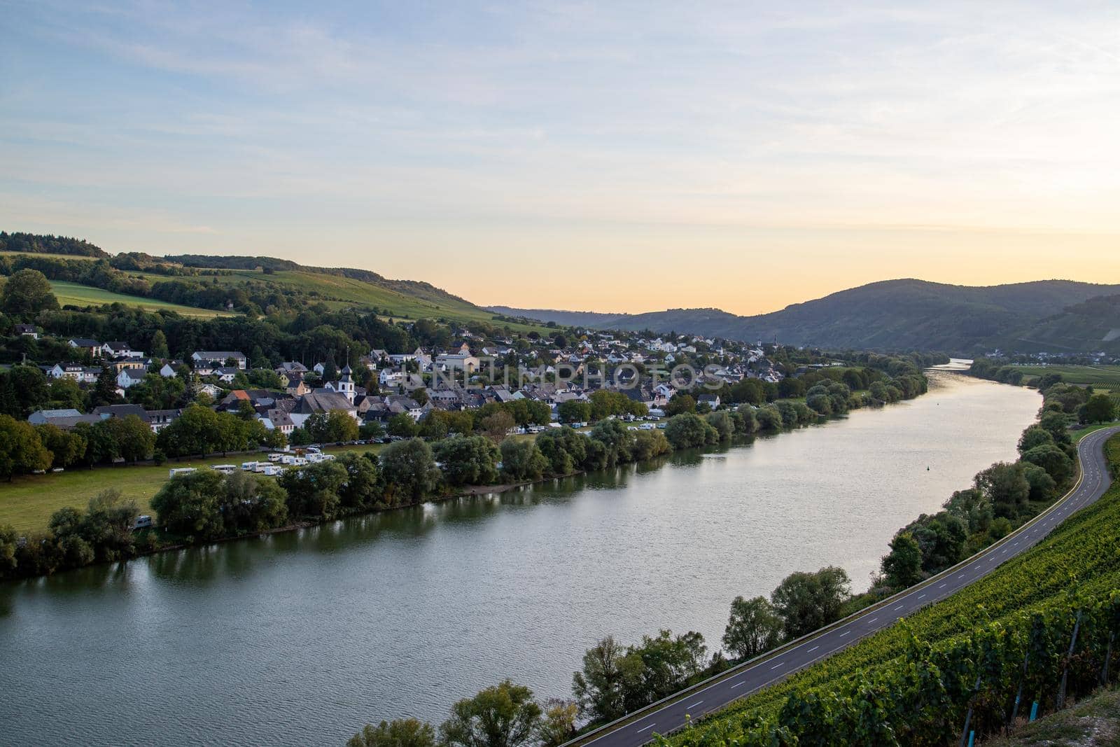 Panoramic view of the Moselle valley with the wine village Brauneberg in the background on a sunny autumn day