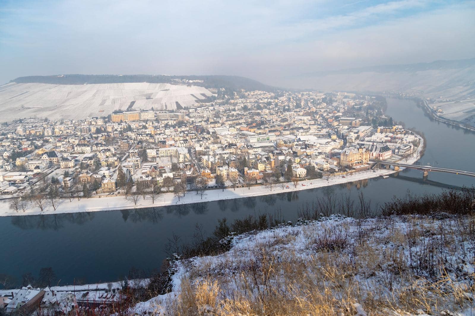 Scenic view of the river Moselle valley and Bernkastel-Kues in winter with snow