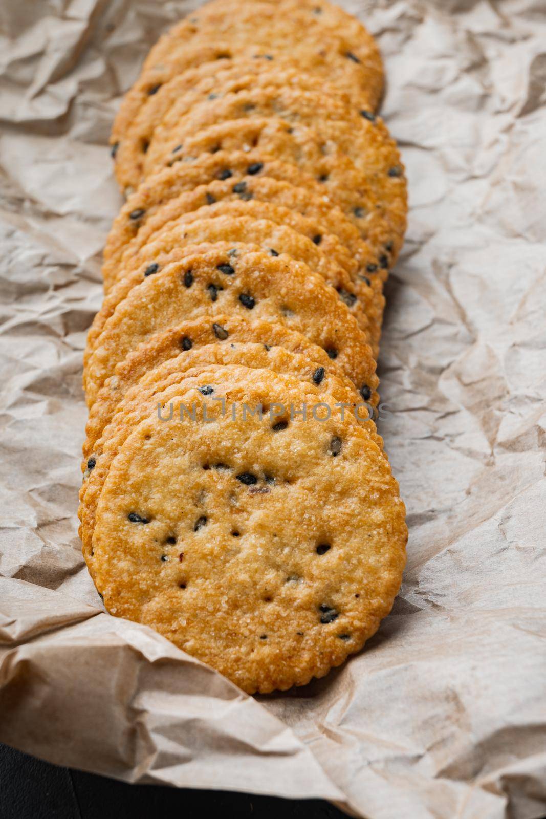 Crackers with flax seed set, on black background