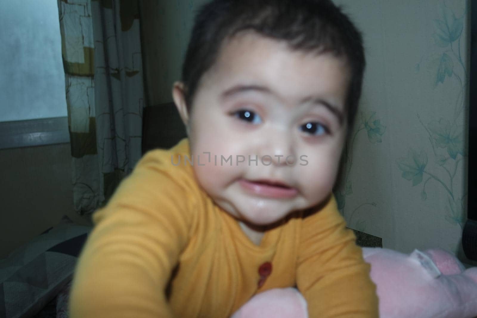 Baby girl with lovely face, big eyes and cute face gesture by Photochowk