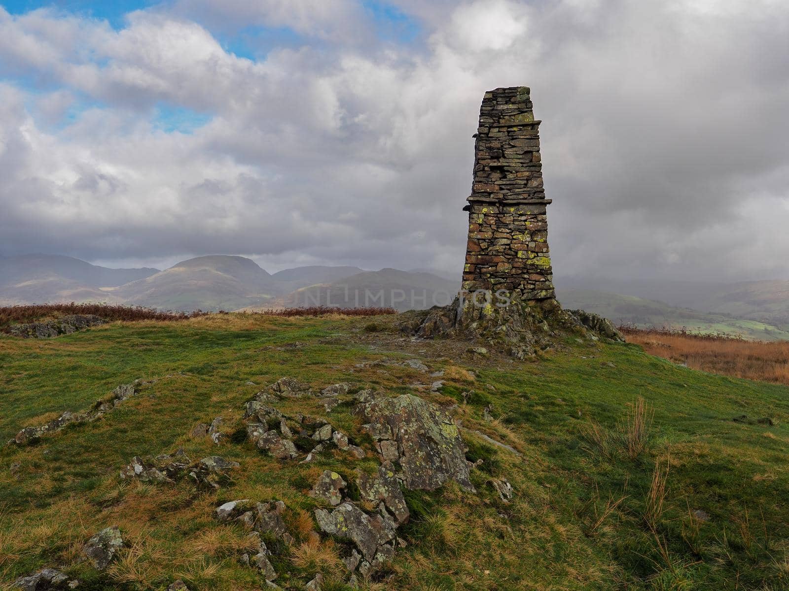 Stone beacon at the top of Latterbarrow overlooking fells, Lake District by PhilHarland