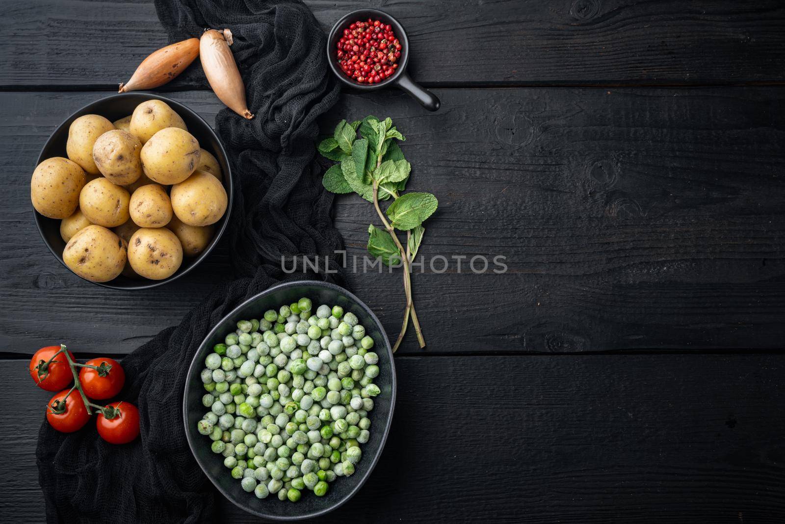 Mashed mint potatoes ingredient, top view, on black wooden background with copy space