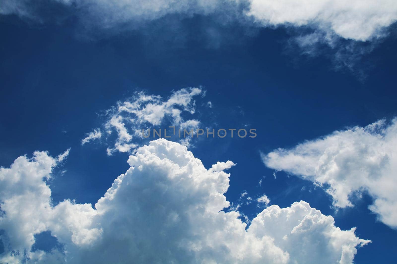 huge heap white cloud blue sky in the autumn and sunlight shiny on a day