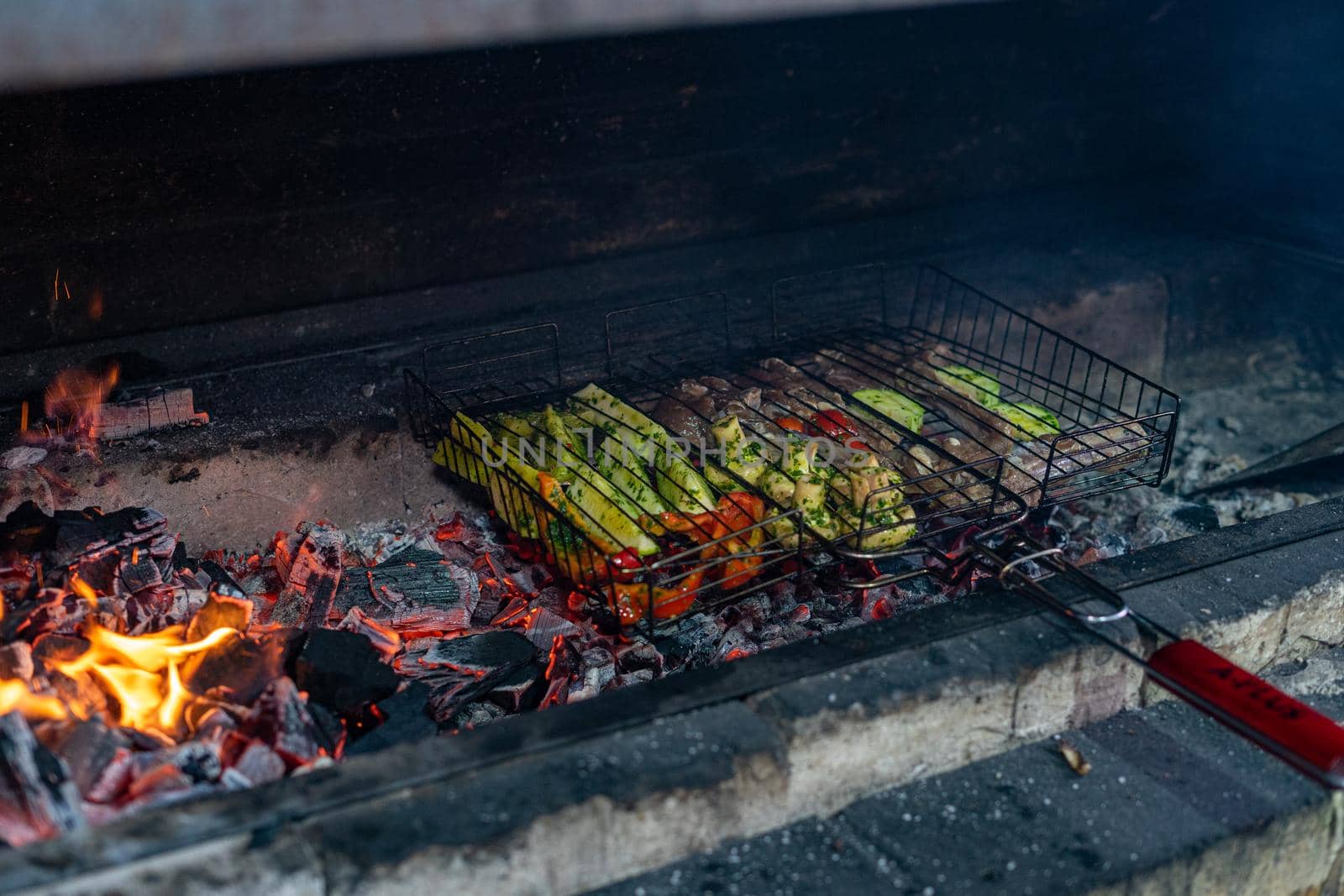 Meat and vegetables are grilled. Cooking on the fire