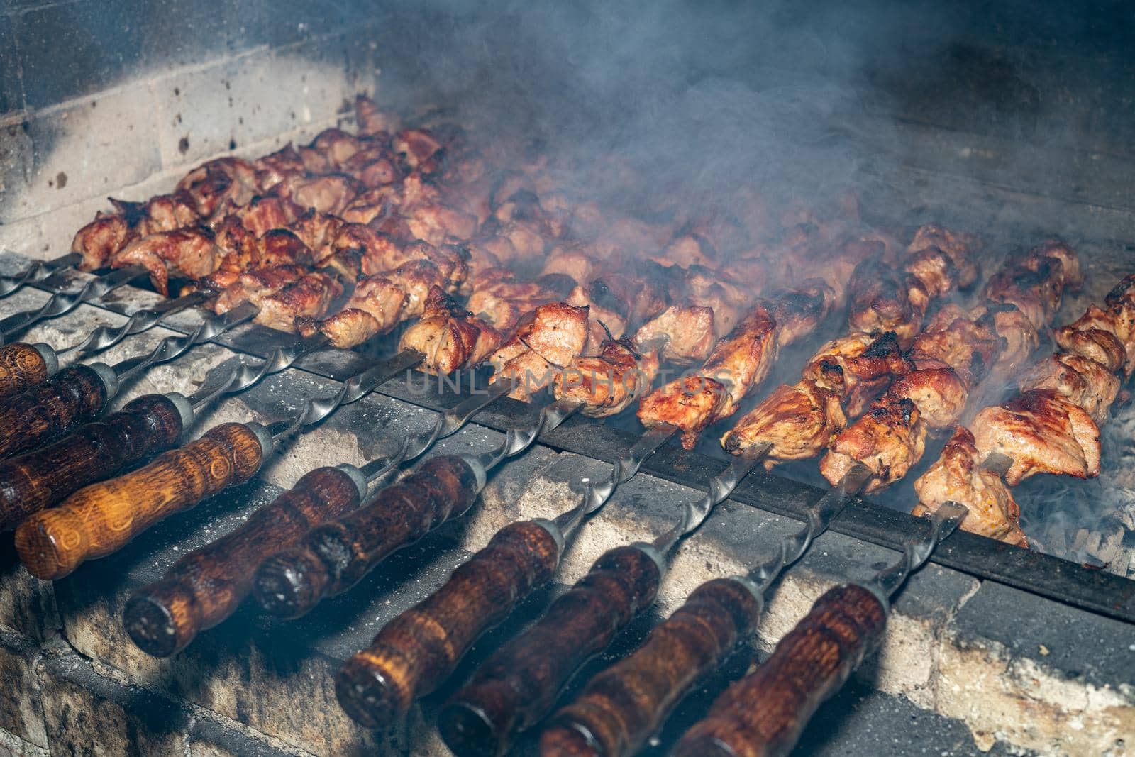 Frying kebabs. Cooking delicious barbecue. Ancient recipe for cooking. by Serhii_Voroshchuk