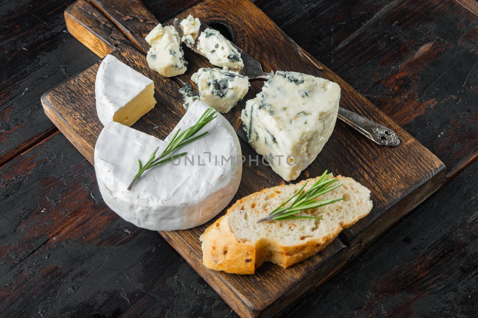 French camembert cheese set, on dark wooden background